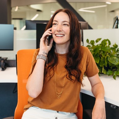 Smiling woman on her mobile.