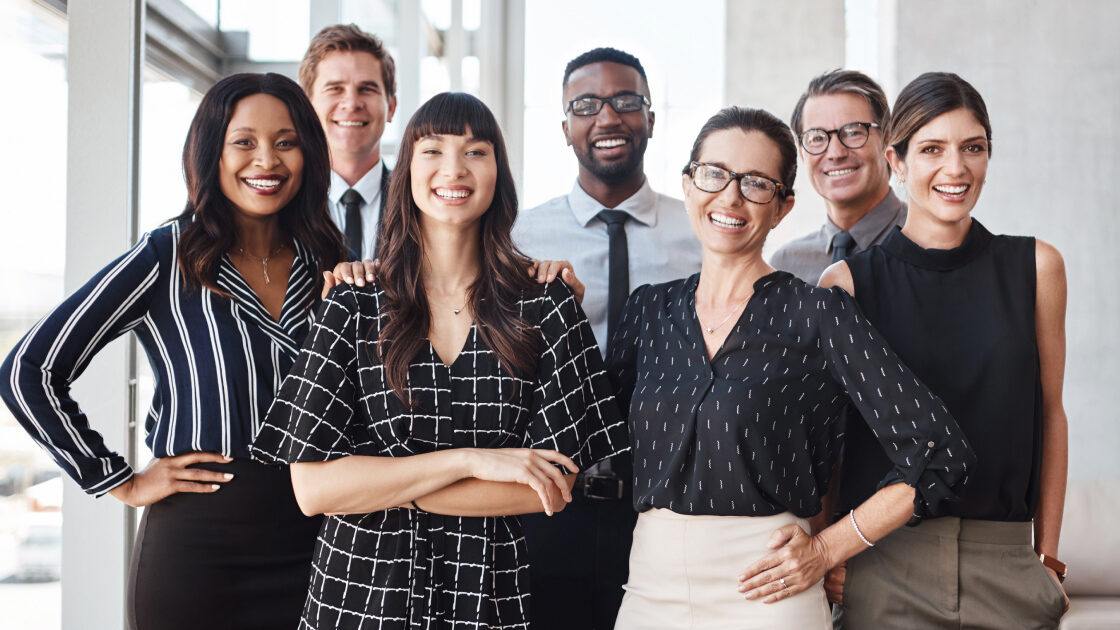 A group of business people looking into the camera.