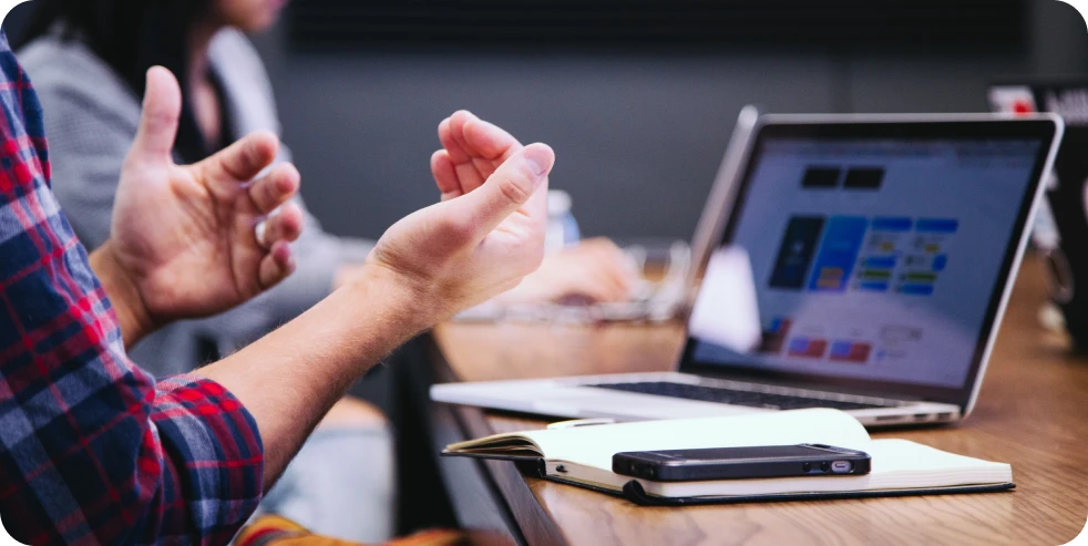 Close-up of gesturing hands.