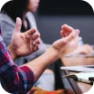 Close-up of gesturing hands.