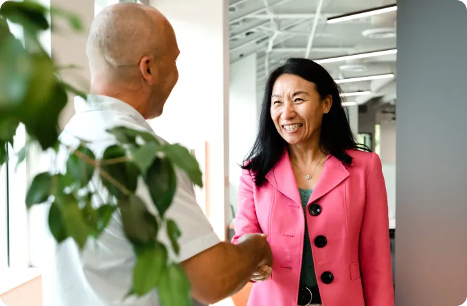 A man and a woman shaking hands